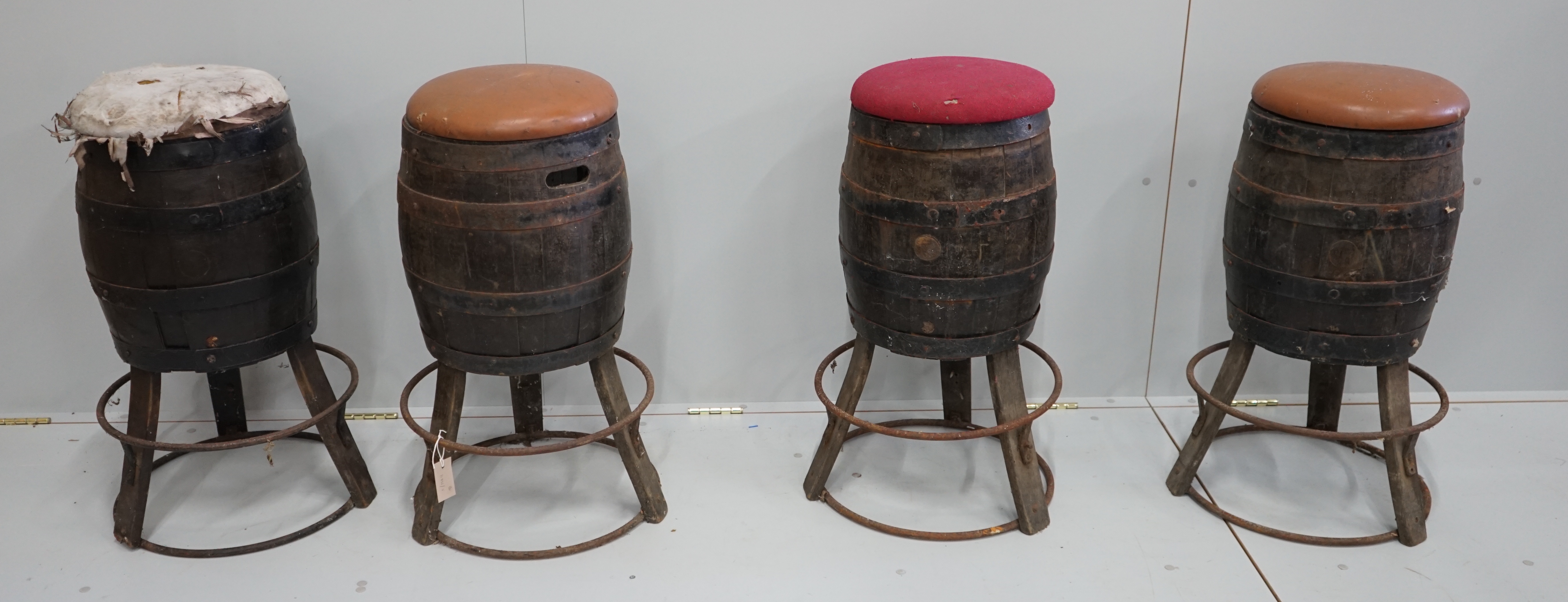 A set of four barrel bar stools, height 73cm